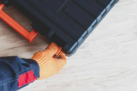 Hands with a case. gloves, tool box, person Stock Photos