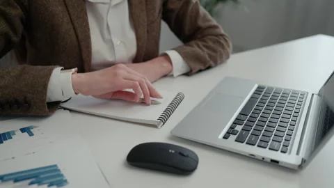 Hands of the Caucasian Charming Lady Taking Records Using a Laptop. Stock Footage 262509953