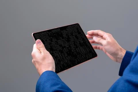 Hands of caucasian male programmer using tablet with coding on screen Stock-Fotos