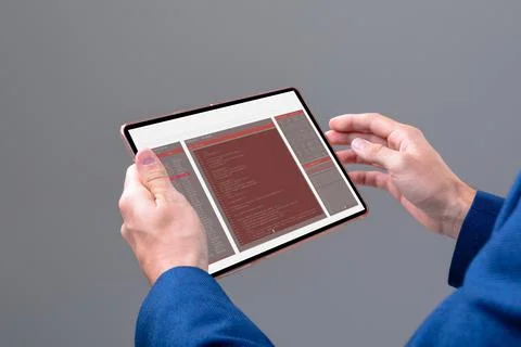 Hands of caucasian male programmer using tablet with coding on screen Stock-Fotos