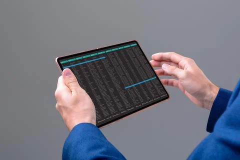 Hands of caucasian male programmer using tablet with coding on screen Stock-Fotos