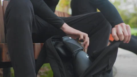 Hands of caucasian man opening backpack, closeup of textured fabric zipper Stock Footage 325032702