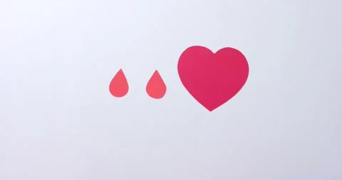 Hands of caucasian man over heart and blood drops on white background, slow Stock Footage 341560153