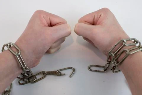 Hands chained together Stock Photos