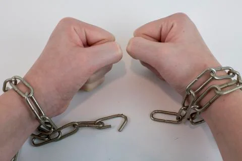 Hands chained together Stock Photos