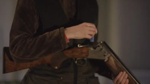 Hands Chambering Blue Shell in Break Action Shotgun, Hunting Attire, Macro Video stock 341319219