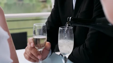 Hands with champagne glasses at a buffet close-up	 Stock Footage 309497101