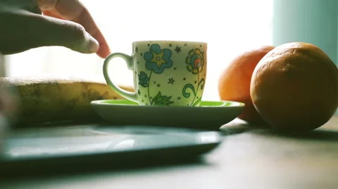 Hands chatting with smartphone and drinking coffee, indoor for a break time, Stock-Footage 57844393