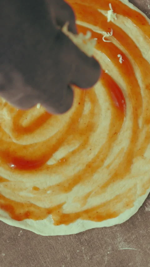 Hands, chef and cheese in bakery for pizza dough, baking and cooking or catering 库存影片 340457859