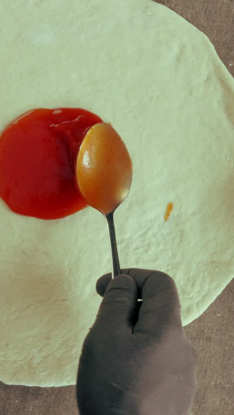 Hands, chef and sauce in kitchen for pizza dough, baking and cooking or catering Stock Footage 340451317