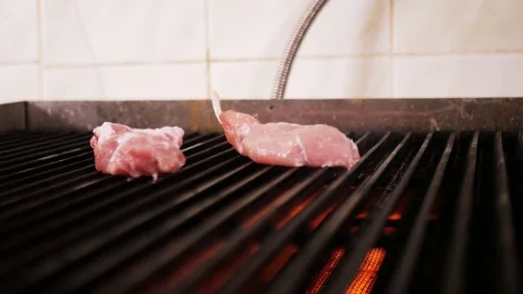Hands chef in black gloves put a piece of meat on the stove. Cooking steak. Stock Footage 108719453