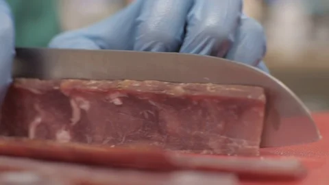 Hands chef cook using knife for cutting meat while cooking in kitchen close up Stock Footage 90911244