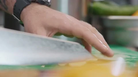 Hands of chef cutting fresh ginger on slices. Man making herbal mix for healthy Stock Footage 203005521