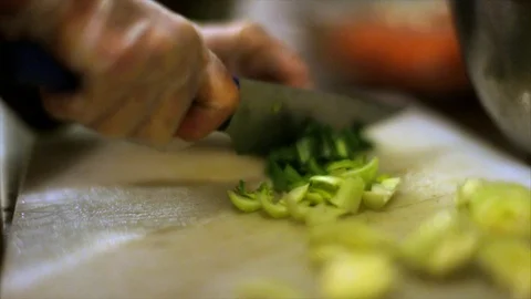 Hands of a chef cutting green vegetables. Stock Footage 88405378