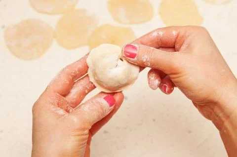 Hands of chef with dumplings Stock Photos