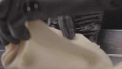 Hands of chef in gloves making khinkali. Stock Footage 313981555