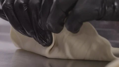 Hands of chef in gloves making khinkali. Stock Footage 314971471