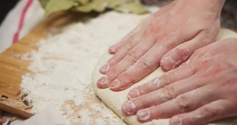 Hands of chef kneading flour dough for bread in bakery shop. Close up hands with Stock Footage 144674949