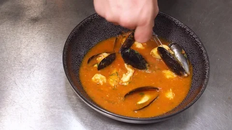Hands of chef preparing soup in restaurant Stock Footage 77524886