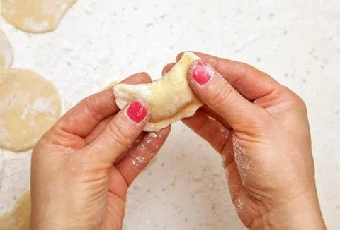 Hands of chef with ravioli Stock Photos