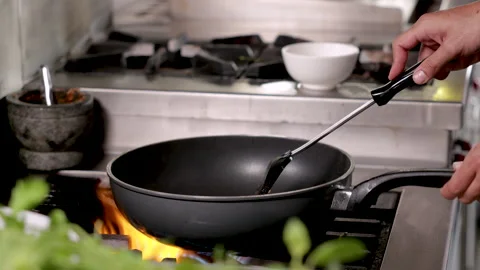 Hands of chef students trainee cooking chineses food in hot pan, chef with .. Video stock 245131814