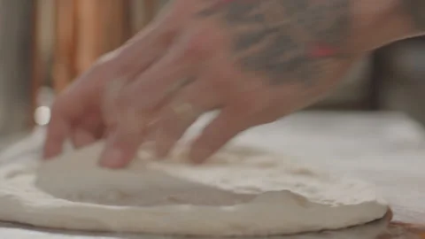 Hands of Chef Tossing and Stretching Pizza Dough Stock Footage 261892066