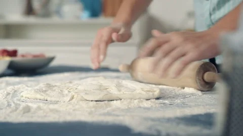Hands chefs in flour roll the dough Stock Footage 72546411