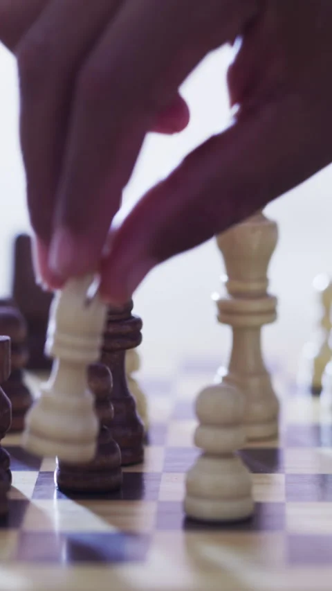 Hands, chess and bishop with board game, piece and problem solving with Stock Footage 329746388