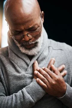 Hands on chest, heart attack and elderly black man with medical emergency in Stock Photos