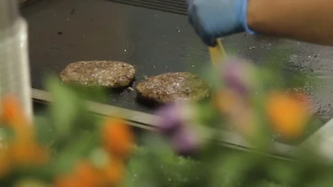 Hands of chief putting chees on meat for burger on grill. Stock Footage 79284582