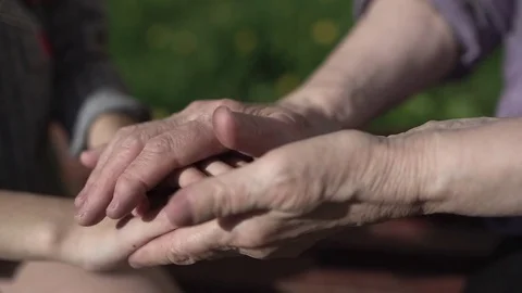 Hands of child and hands of an elder woman Stock Footage 75757690