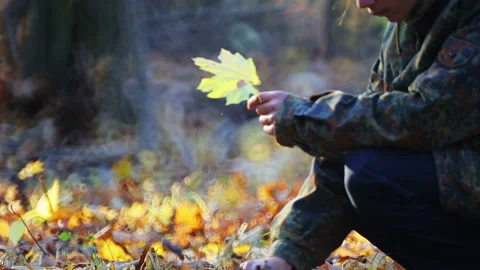 Hands of a child with an autumn leaf in the park. Stock Footage 119896302