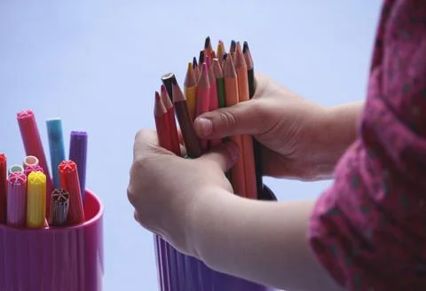 Hands of a child engaged in creativity Stock Photos