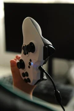 In the hands of a child, a game console Foto stock