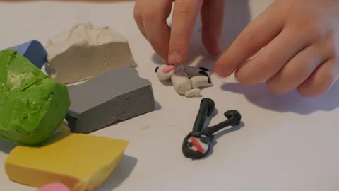 Hands of a child playing with plasticine Stock Footage 127628356