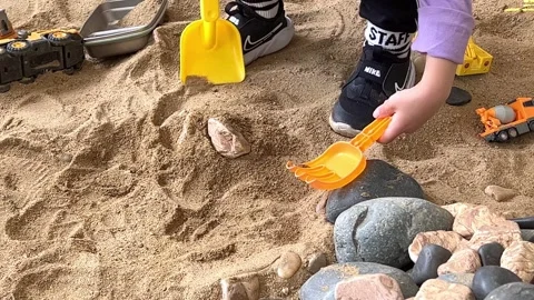 The hands of a child playing in the sand Stock Footage 242649181
