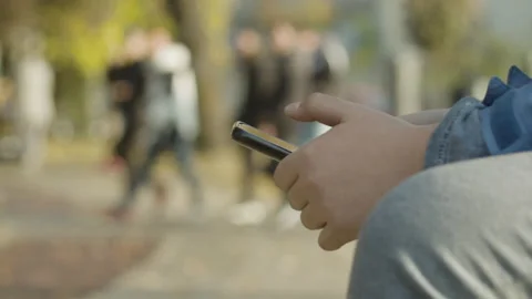 Hands of child using smartphone outdoor close up Stock Footage 143149073