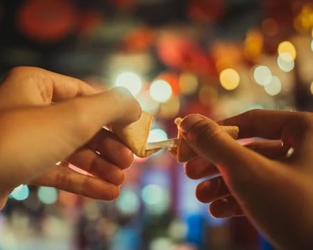 Hands with a Chinese cookie Stock Photos