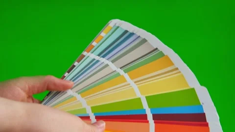 Hands choose the color using the sample swatch on blank green screen mock up 動画素材 237610383