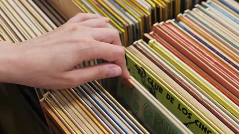 Hands choosing comics, child selecting book while visiting bookshop, kid boy 库存影片 235953654