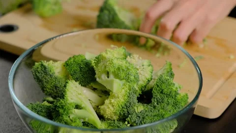 Hands Chopping Broccoli in Cooking Kitchen Video stock 341454918