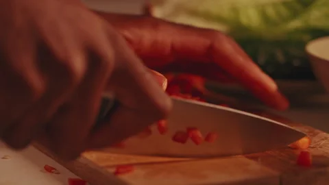 Hands Chopping Fresh Red Bell Pepper on Cutting Board Stock Footage 331753596