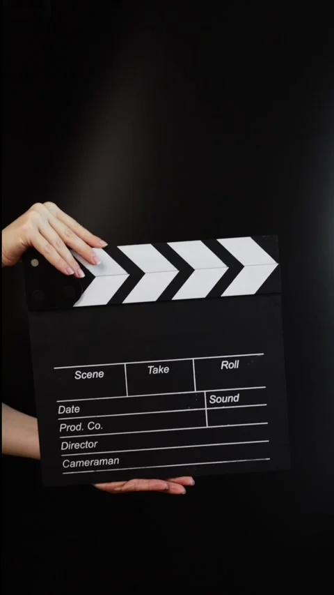 Hands with cinema clapper board, capturing the action, filmmaking in progress Stock Footage 276320918