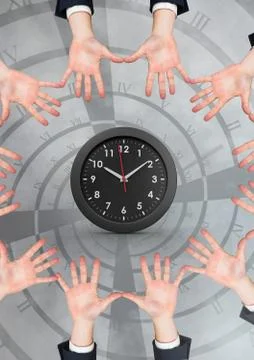 Hands in circle around clock Foto stock