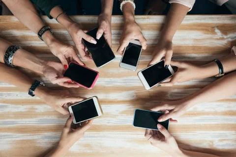 Hands circle using phone in cafe. Stock Photos