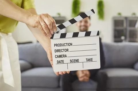 Hands with clapperboard clap and cut action scene of interview and speech of Stock Photos