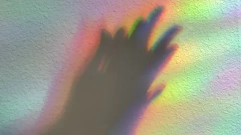 Hands clapping. Shadow on a rainbow background. Stock Footage