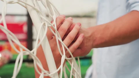 Hands clasped warmly, Holding hands in sunlight, Coupled fingers intertwined in Video stock 329428551