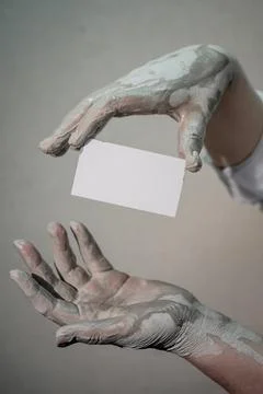 Hands in clay after work at the potter's wheel, close-up holding a mockup of  Stock Photos