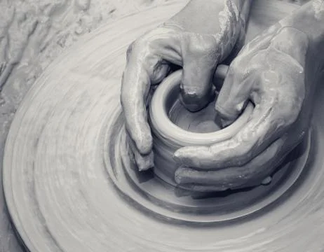 Hands in clay at process of making ceramic on pottery wheel Stock Photos